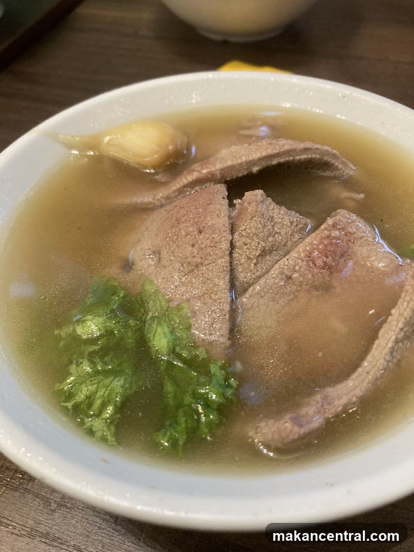 Bowl of Soup with Meat and Greens