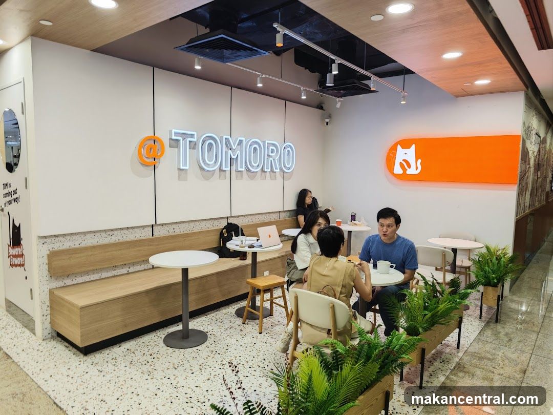 Interior of a cafe with people sitting at tables