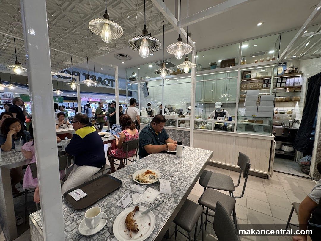 Busy cafe interior with diners and staff