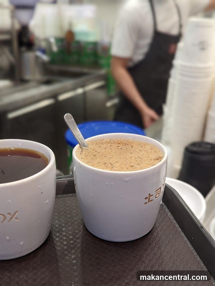 Two cups of drinks on a tray