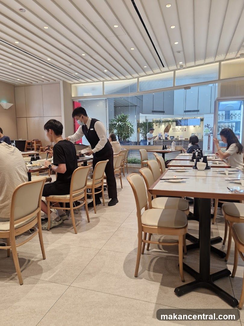 Restaurant Interior with Waiter Serving Table