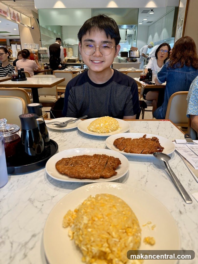 Young man at a restaurant table with food