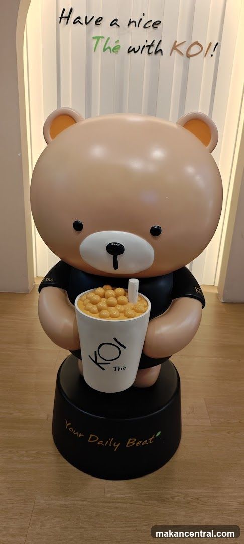 Bear statue holding a bubble tea