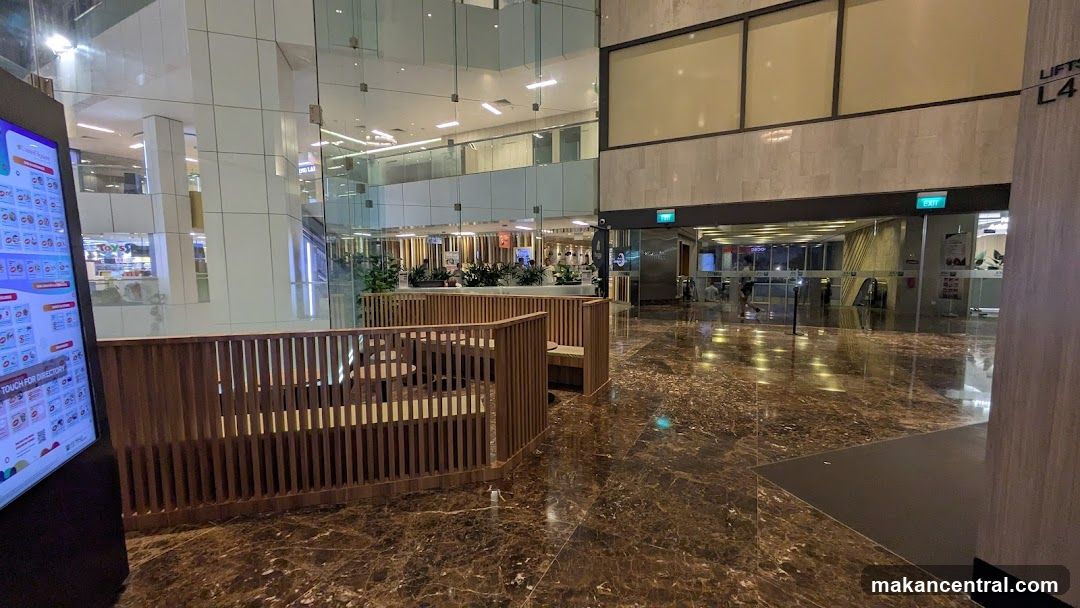 Interior of a modern building with seating area and entrance