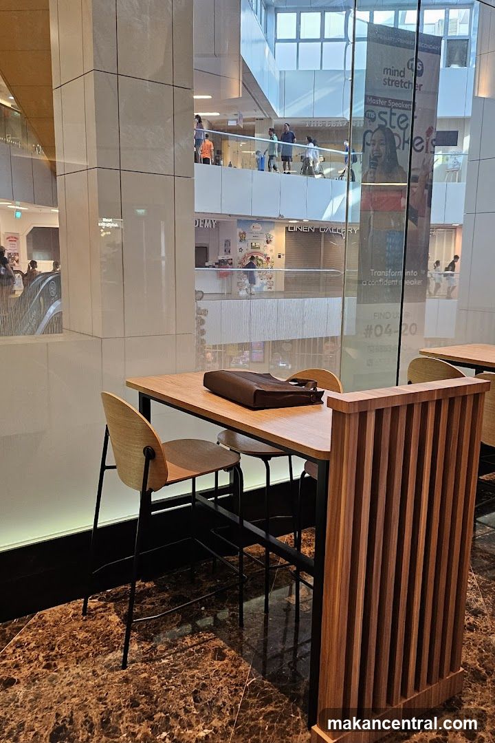 Indoor seating area with a table and chairs