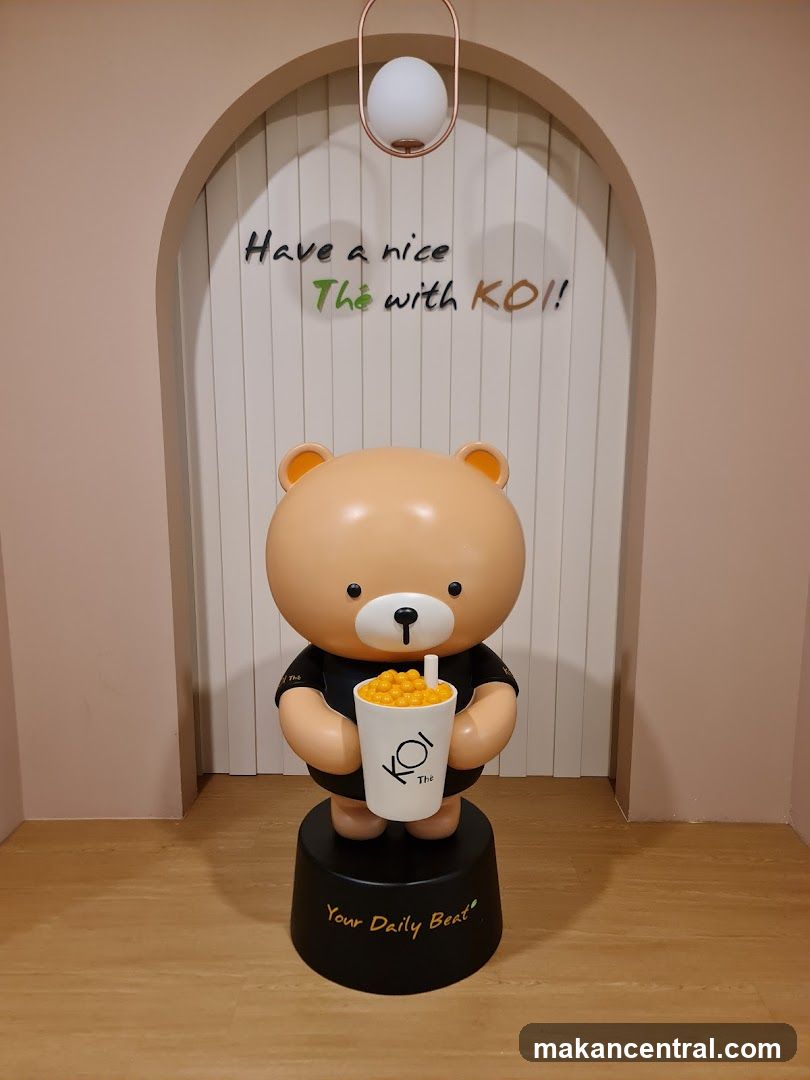 Bear mascot holding a bubble tea