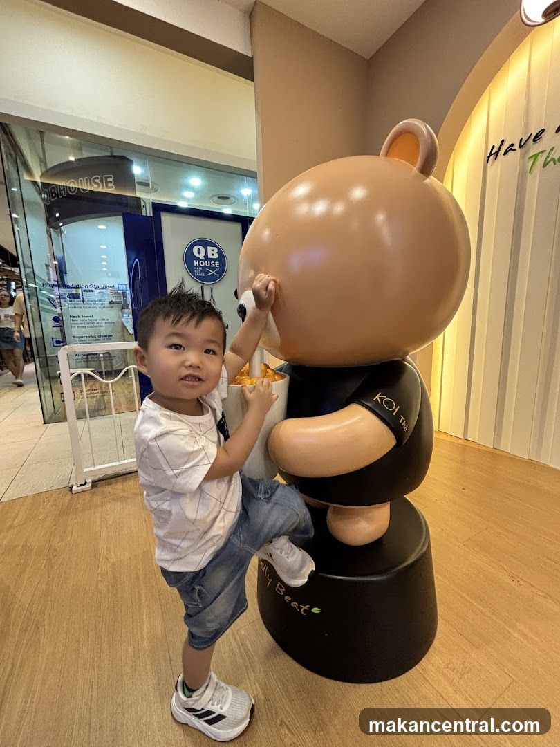 Child Posing with Bear Mascot