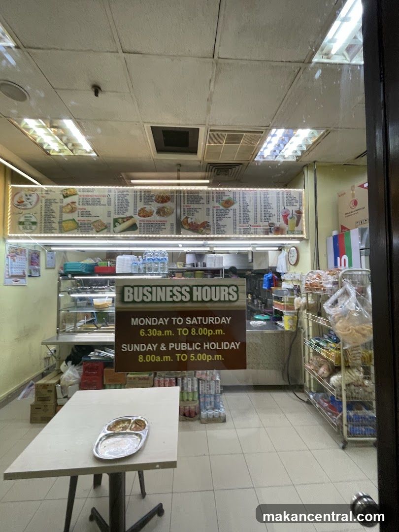 Restaurant Interior with Menu and Business Hours Sign