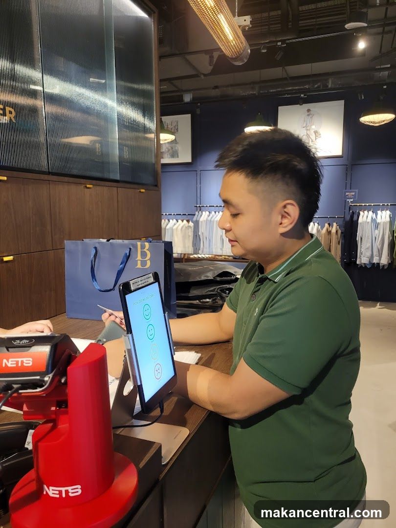 Customer interacting with a tablet at a checkout counter