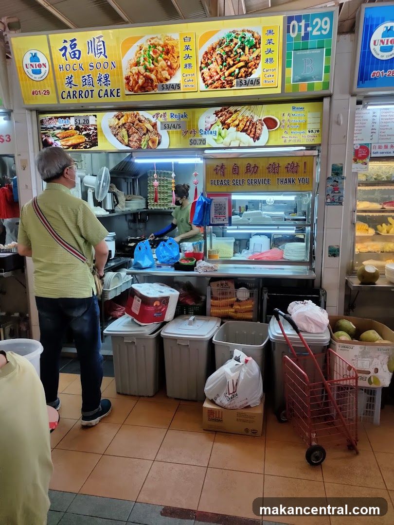 Food stall with menu and staff