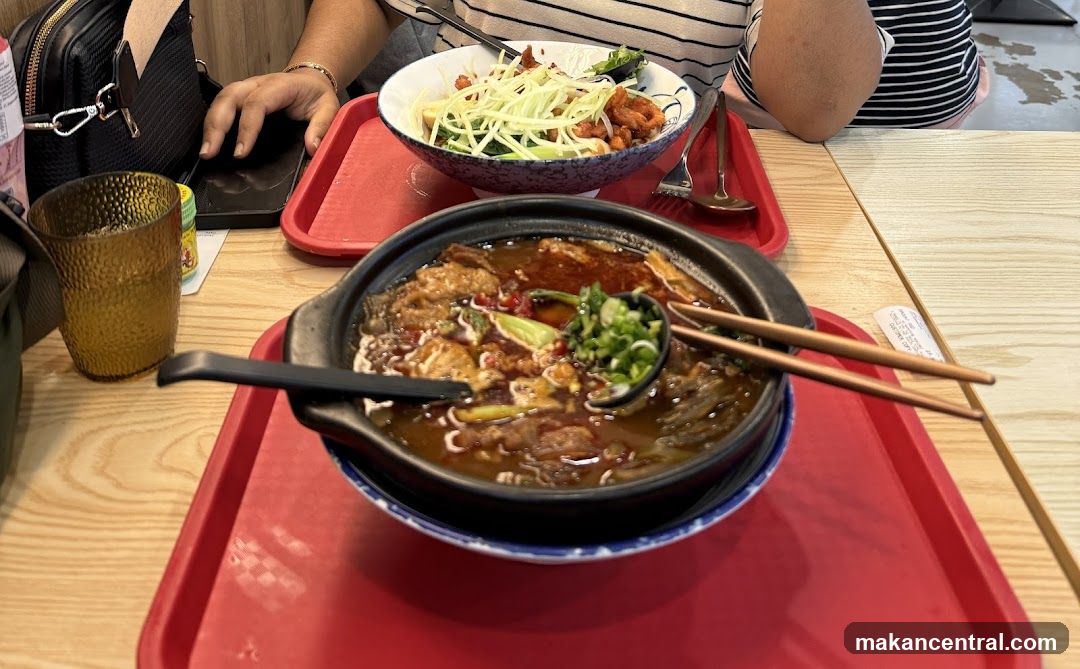 Two bowls of food on red trays