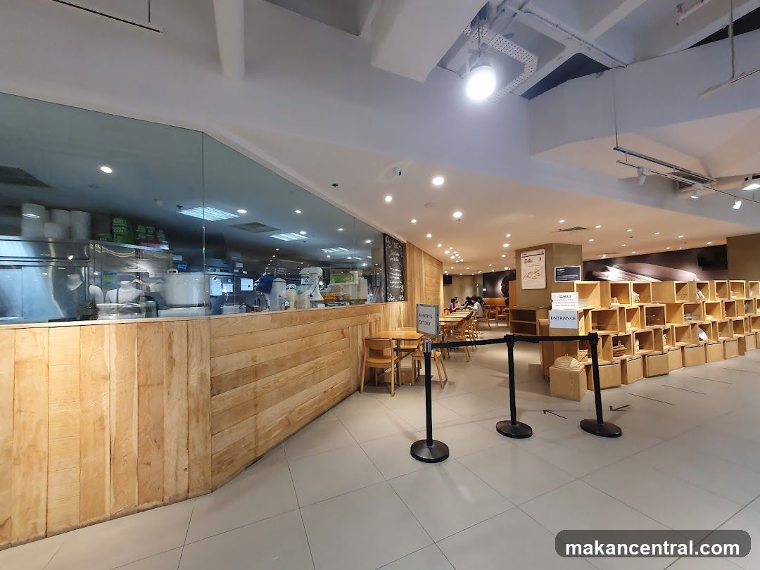 Interior of a cafe with a kitchen view