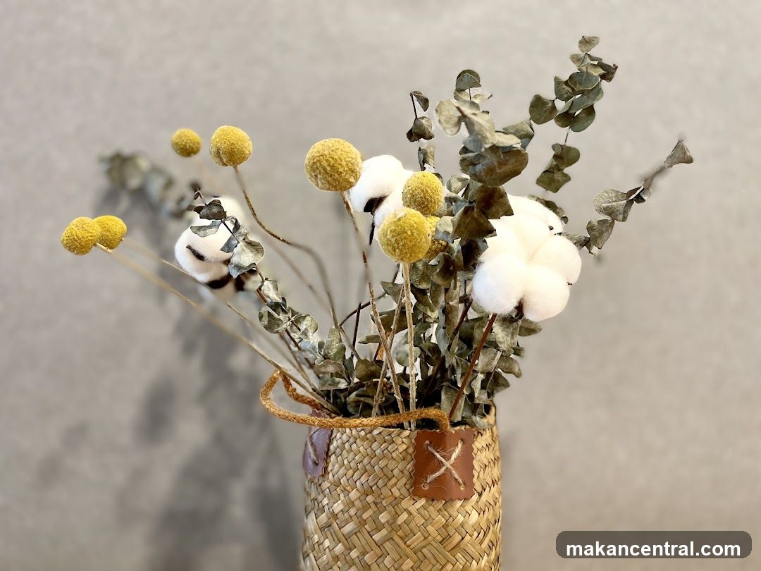 Dried floral arrangement in a woven basket