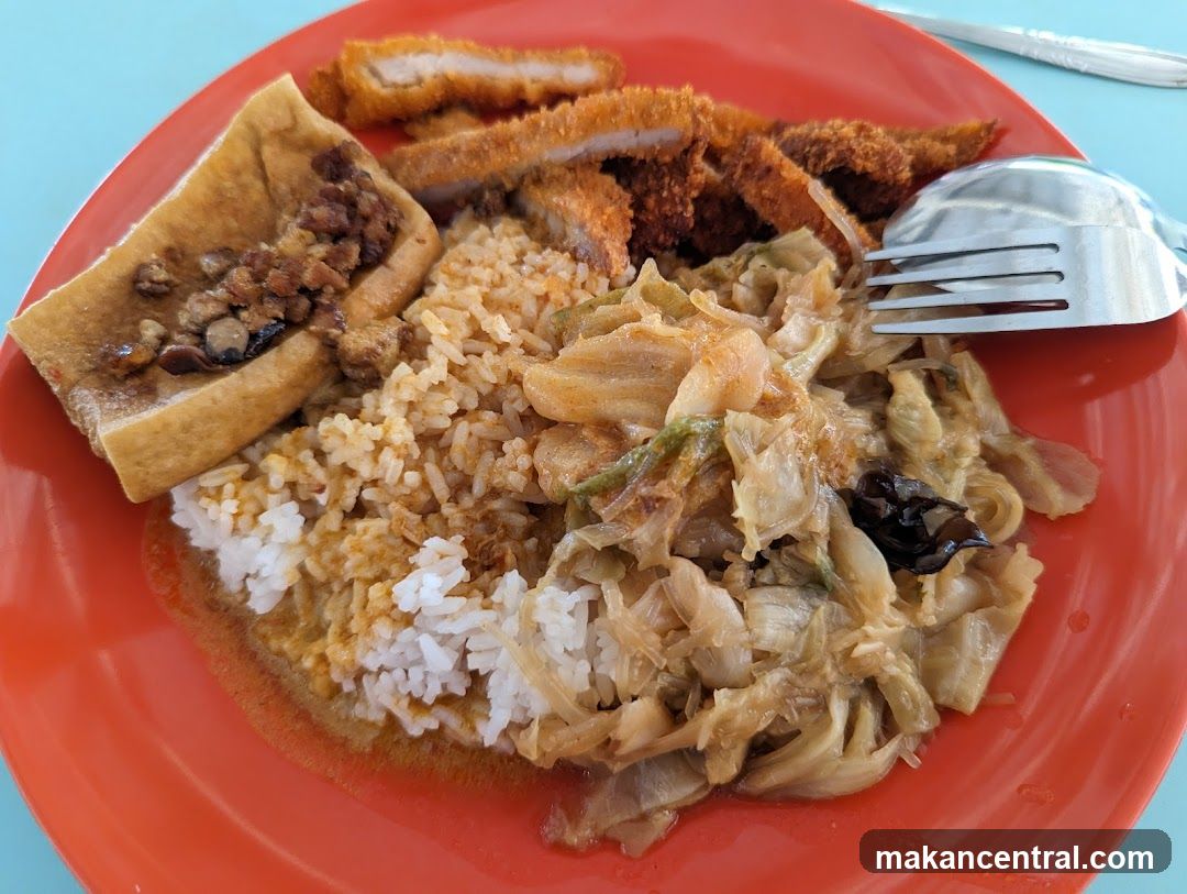 Rice dish with fried pork and vegetables
