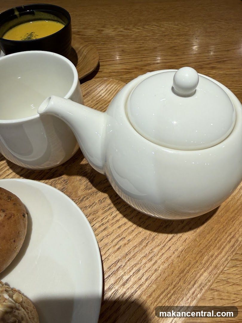 Tea set with soup and bread