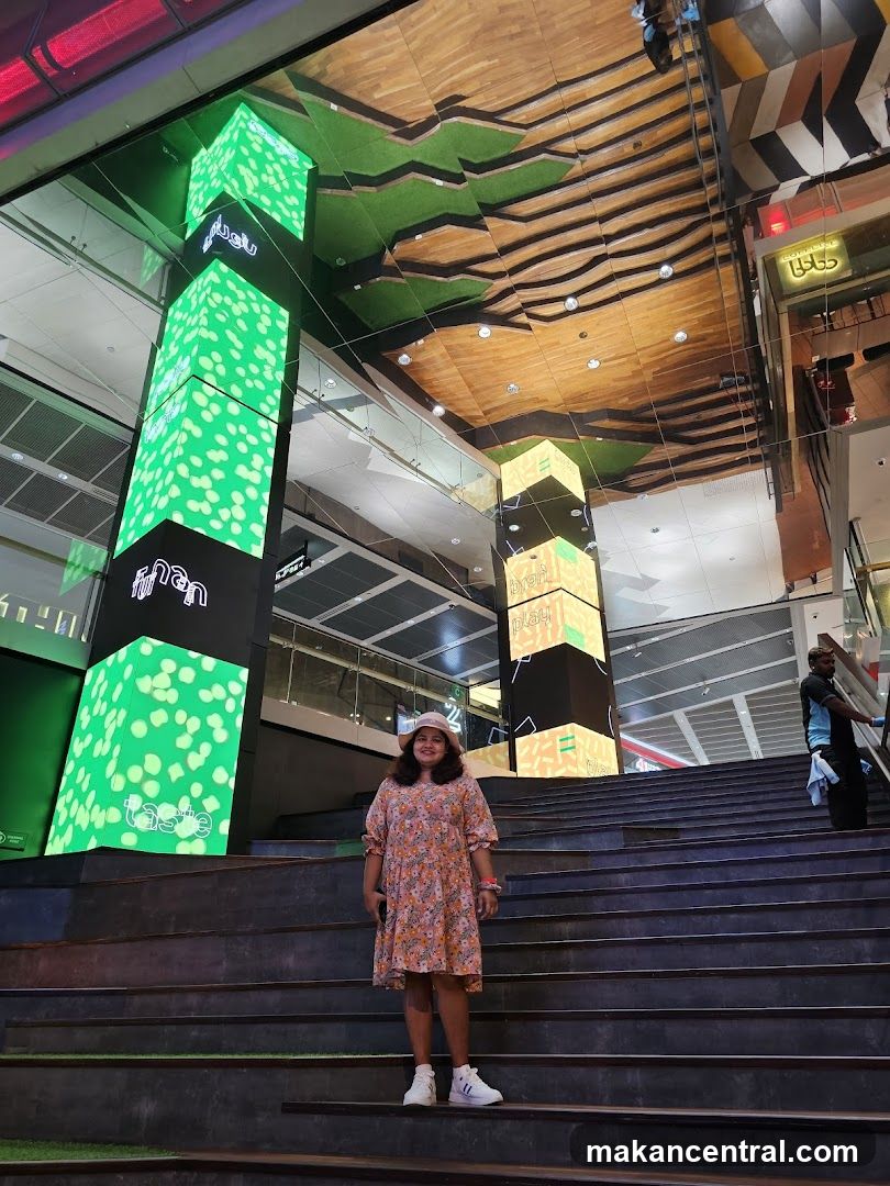 Woman Poses on Stairs in Modern Interior