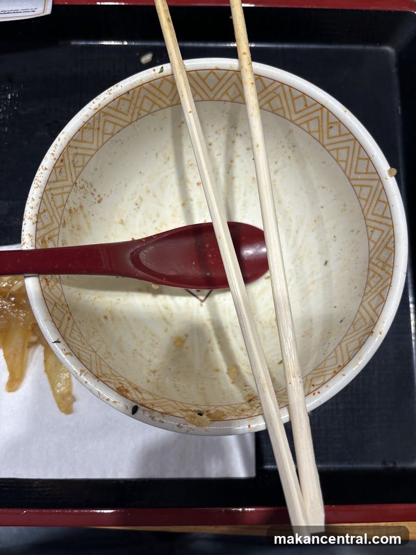 Empty Bowl with Chopsticks and Spoon