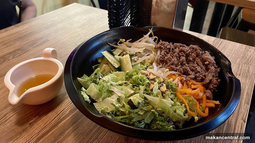 Bowl of food with dressing
