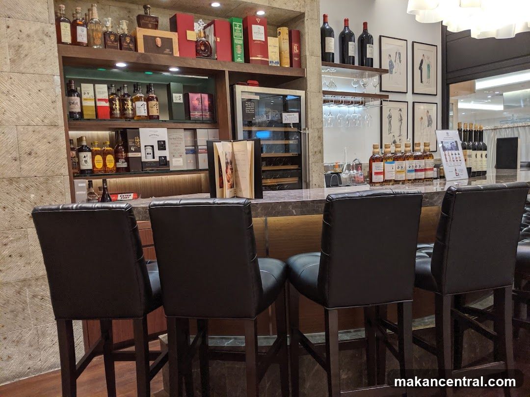 Bar with Bottles and Chairs