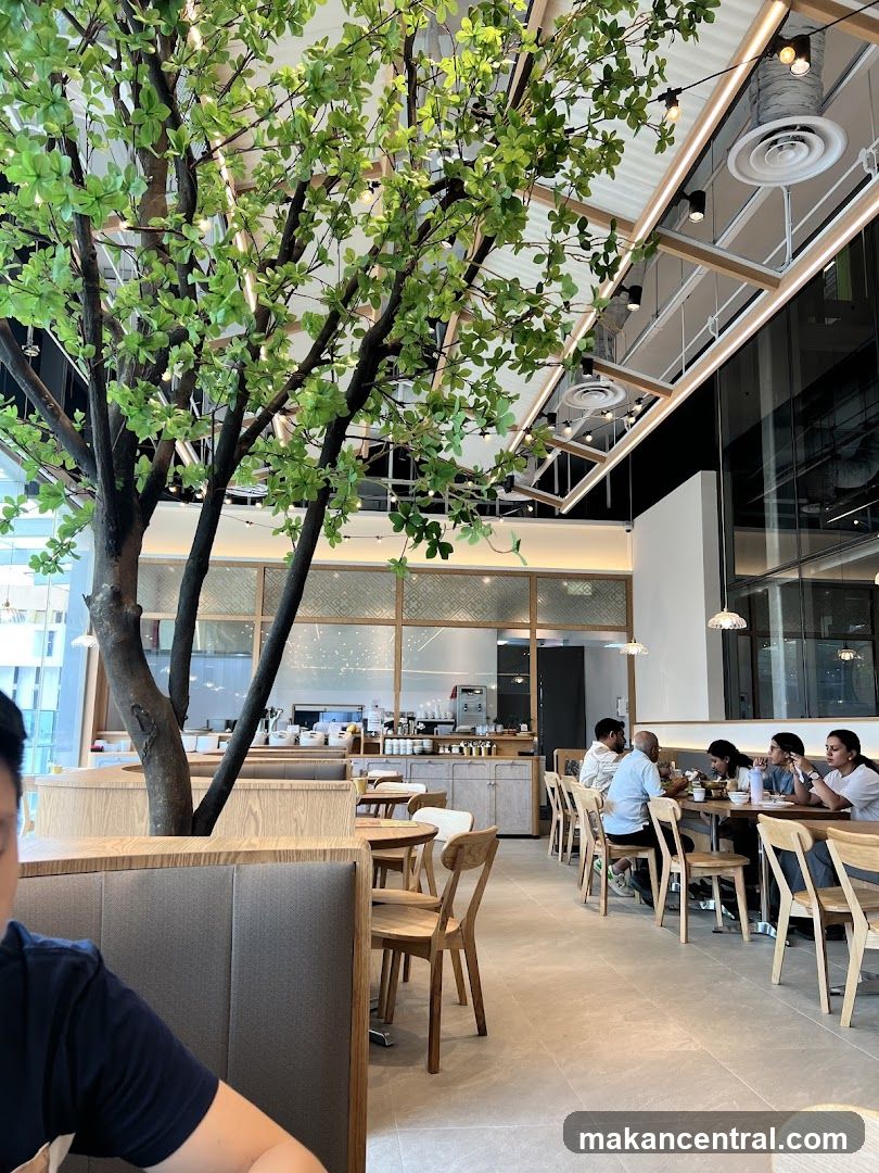 Modern Cafe Interior with Tree Feature