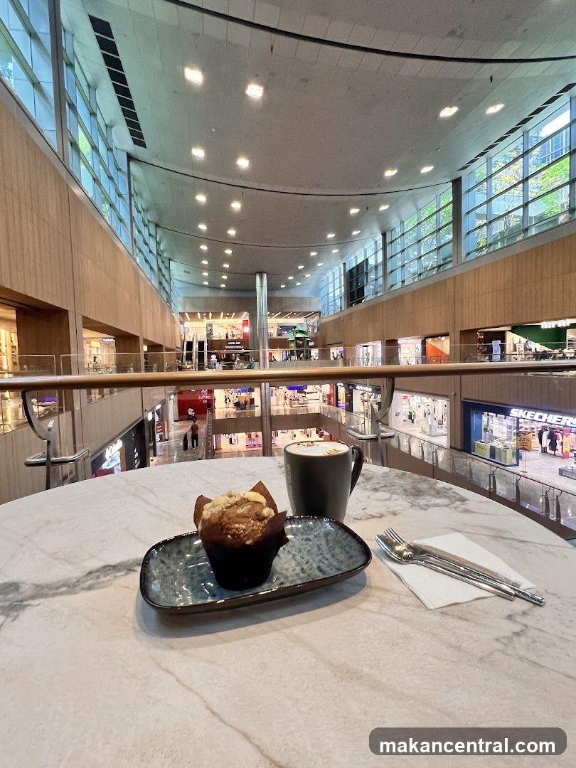 Muffin and Coffee in a Mall