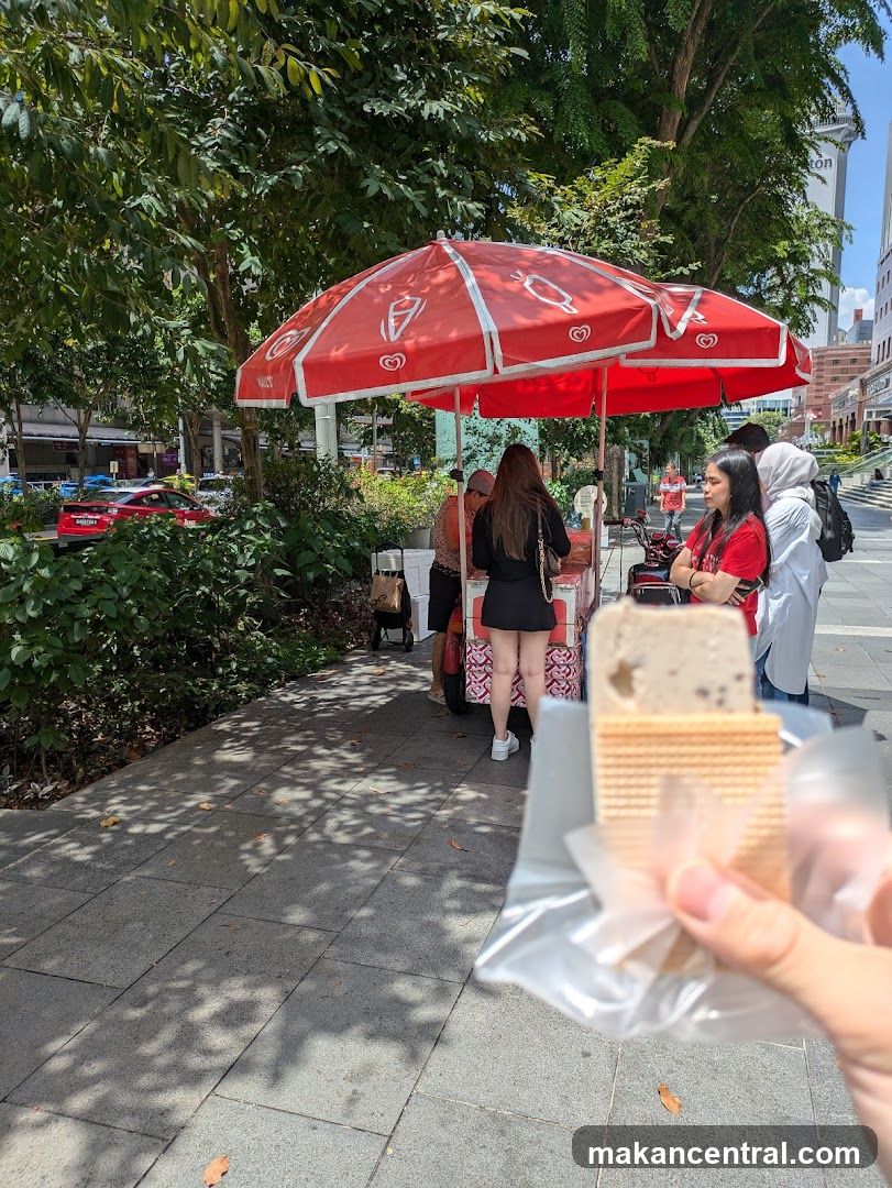 Street food vendor with ice cream umbrella