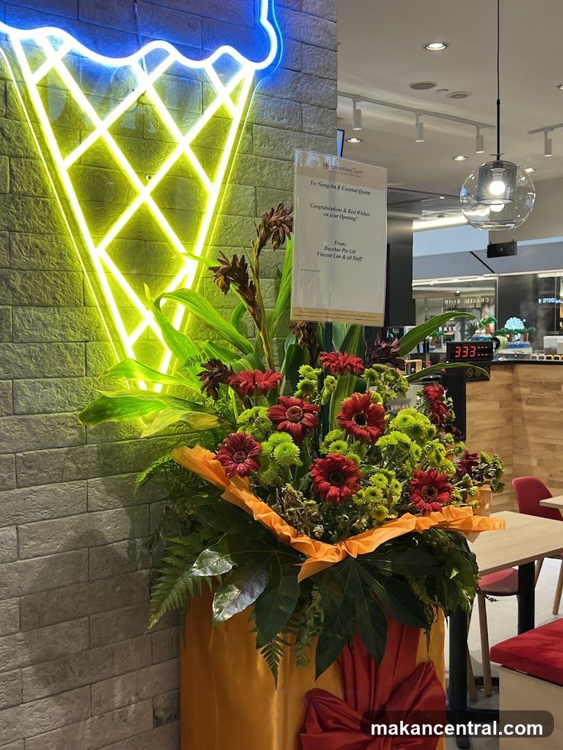 Ice Cream Cone Neon Sign and Flower Arrangement