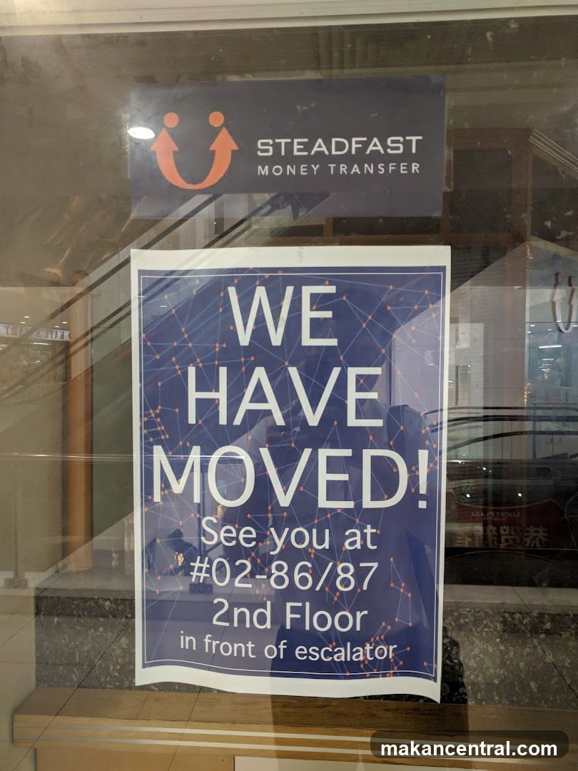 Steadfast Money Transfer "We Have Moved" Sign