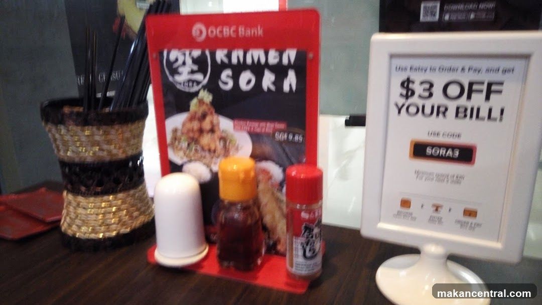 Table setting with menu and discount offer