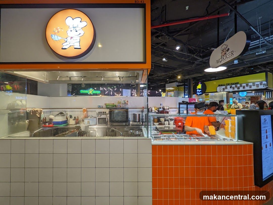 Food stall with chefs preparing food
