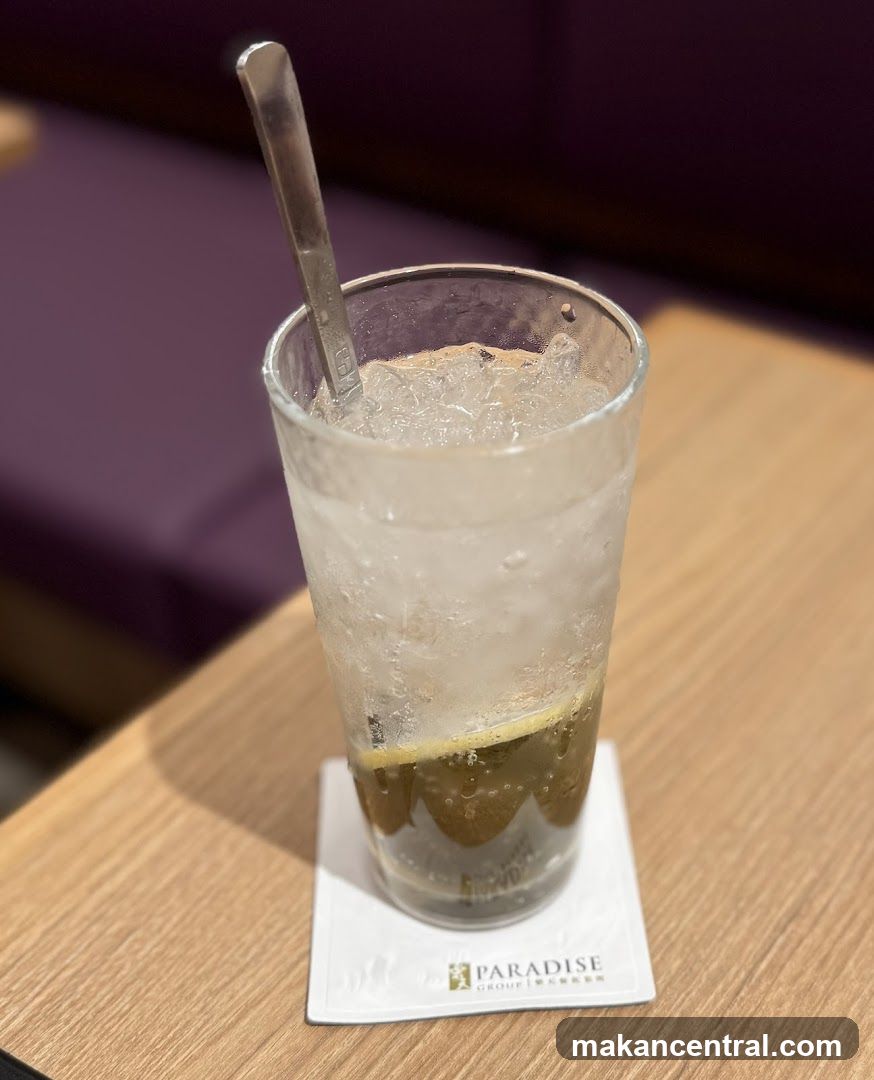 Drink with Spoon and Lemon Slice