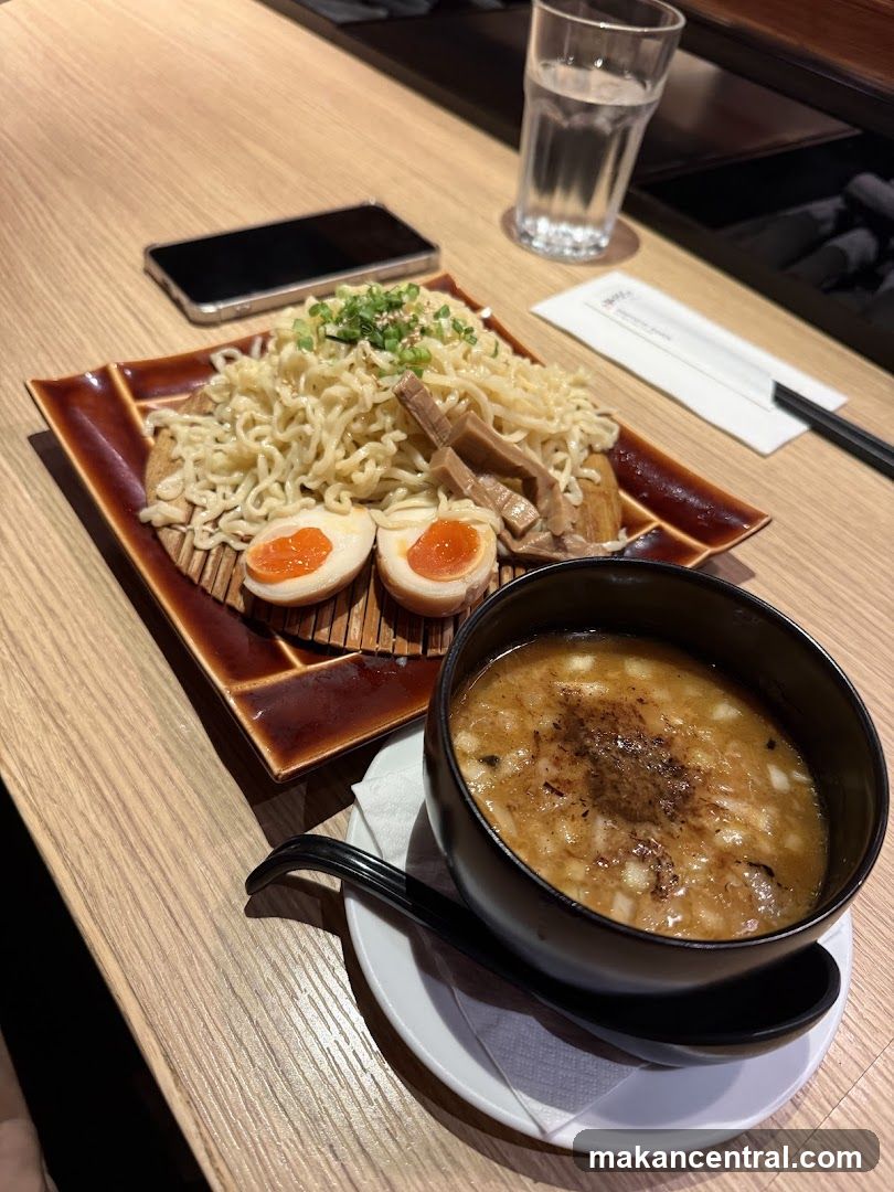 Ramen dish with broth and toppings