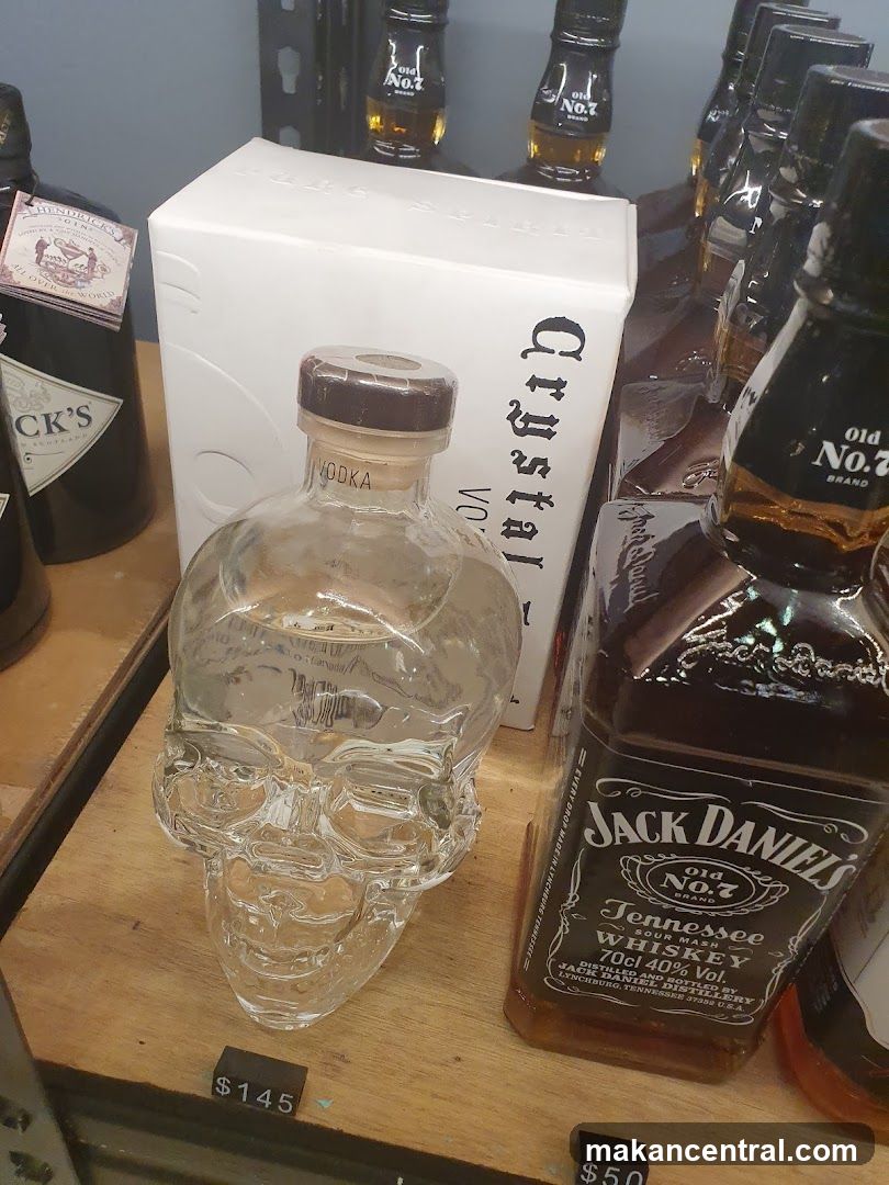 Skull-shaped vodka bottle and Jack Daniel's whiskey