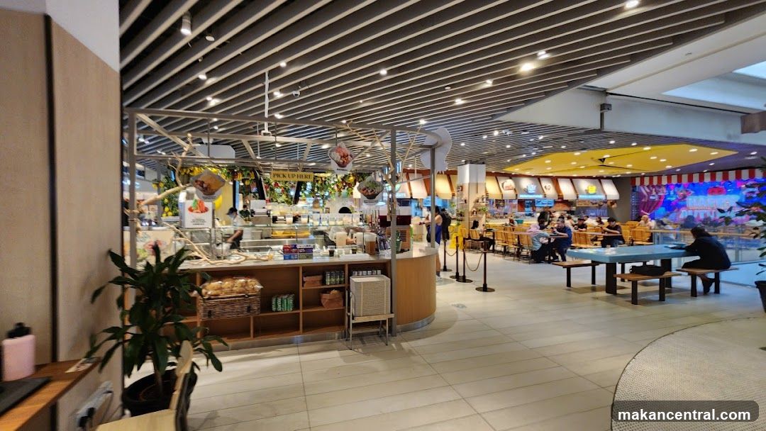 Food Court with Various Stalls and Seating Areas