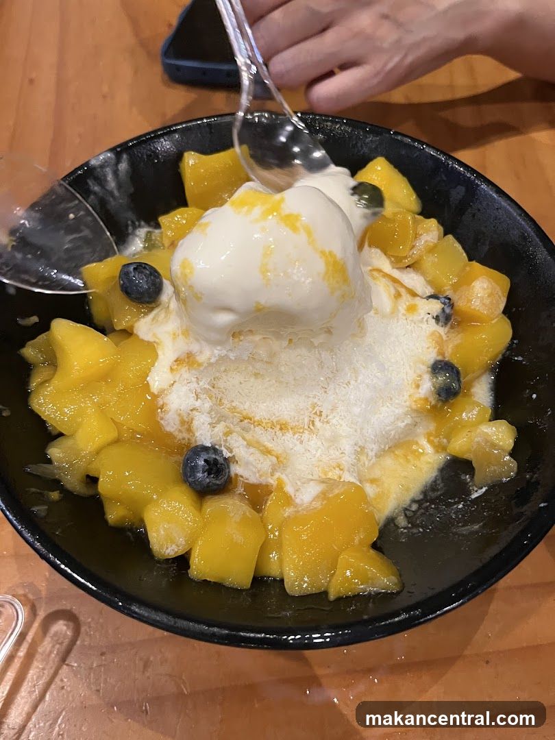 Mango shaved ice with ice cream and blueberries