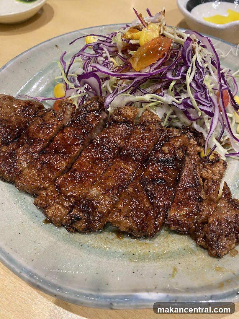 Sliced steak with salad