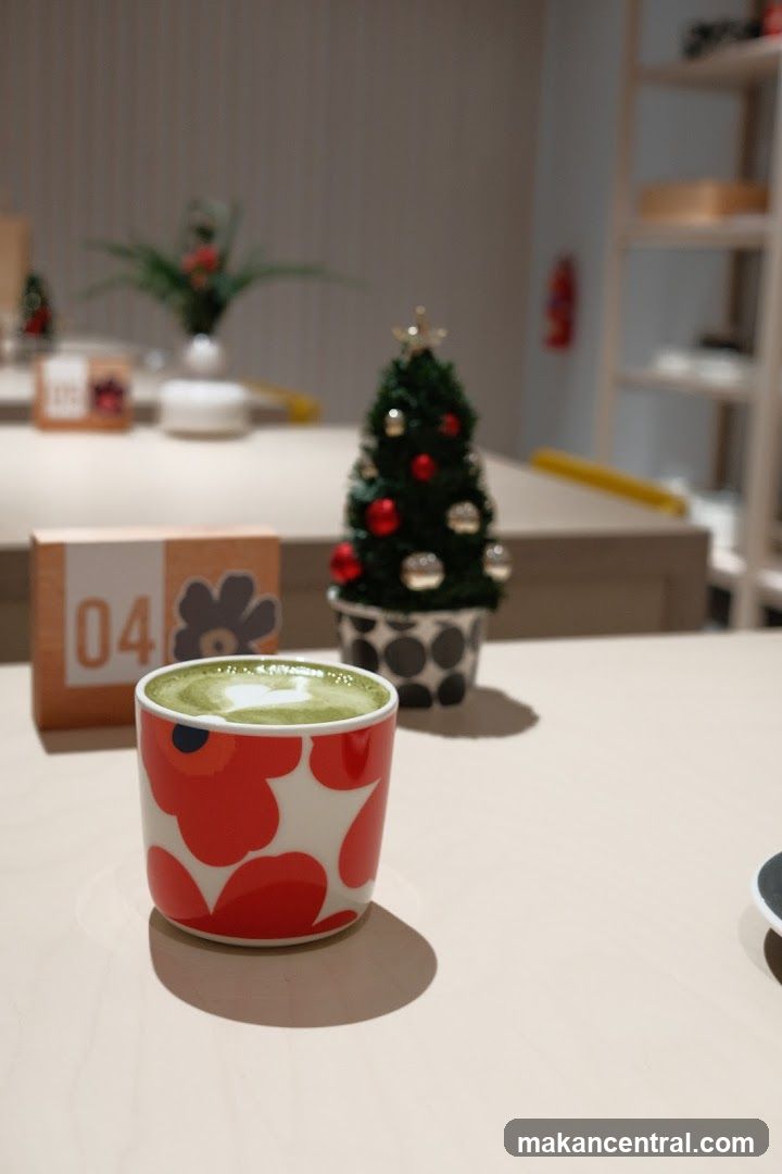 Table setting with a matcha latte and Christmas decorations