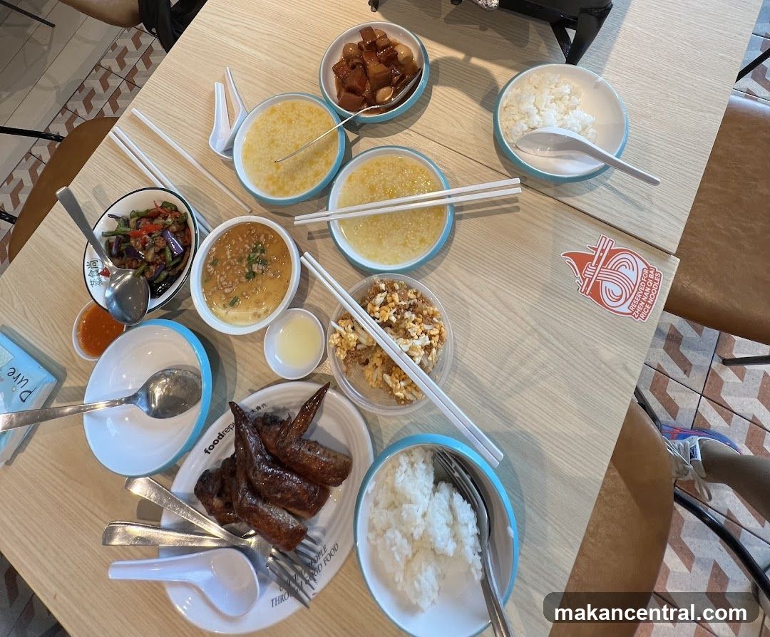 Table with various dishes and rice