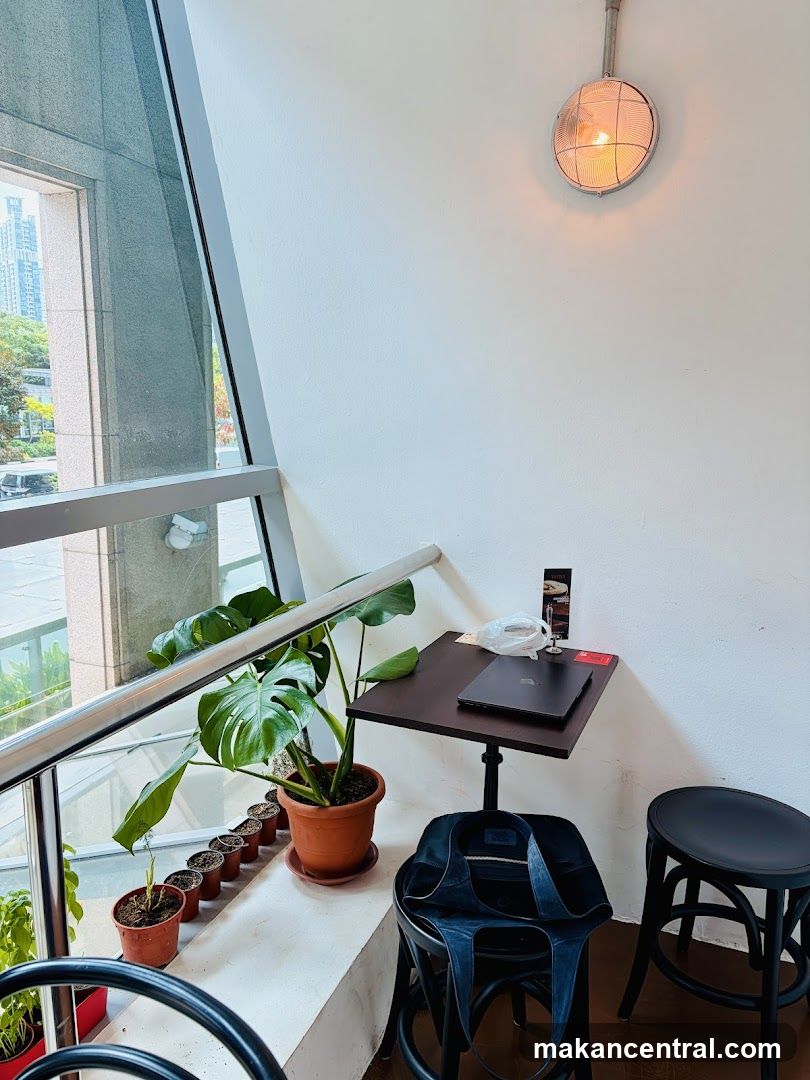 Small table with laptop and plants