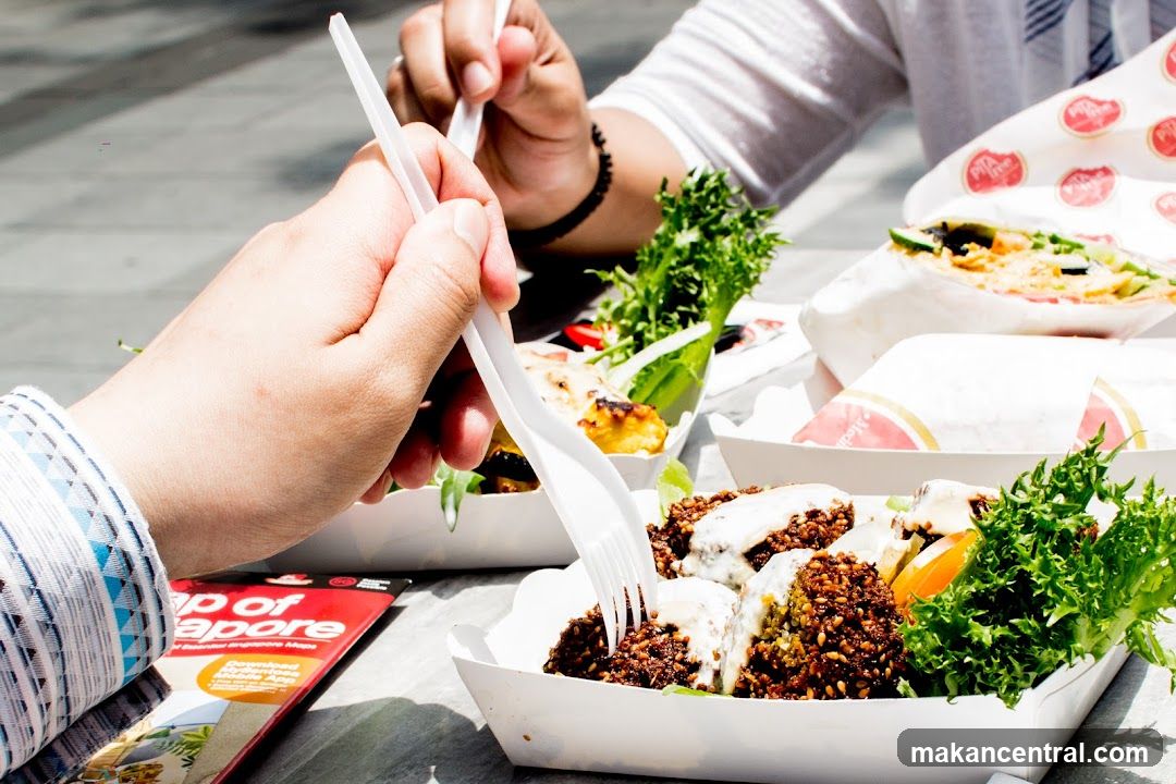People Eating Falafel and Wraps