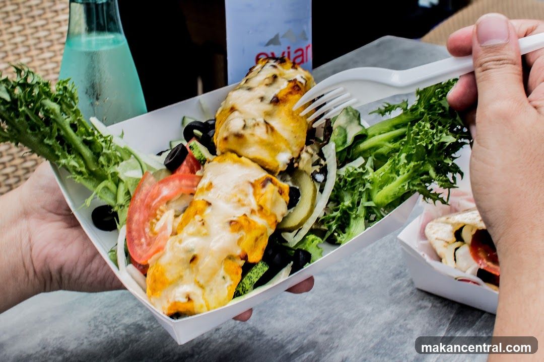 Two people eating takeout food