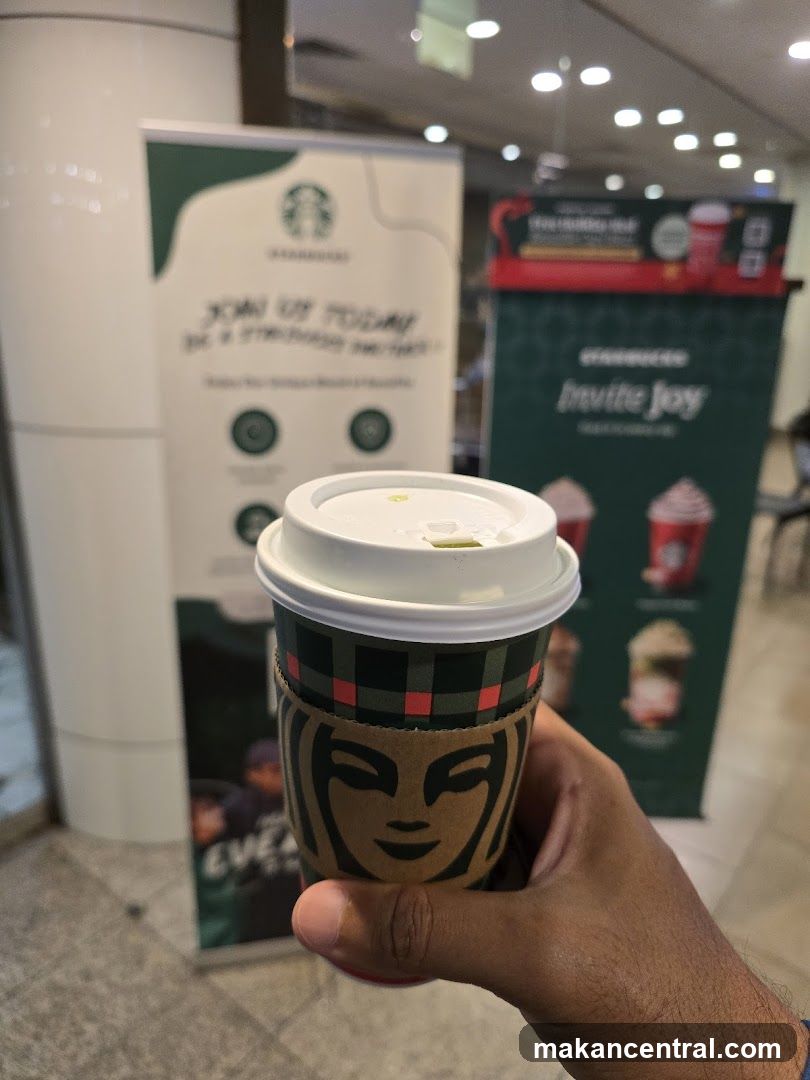 Starbucks cup and promotional banners