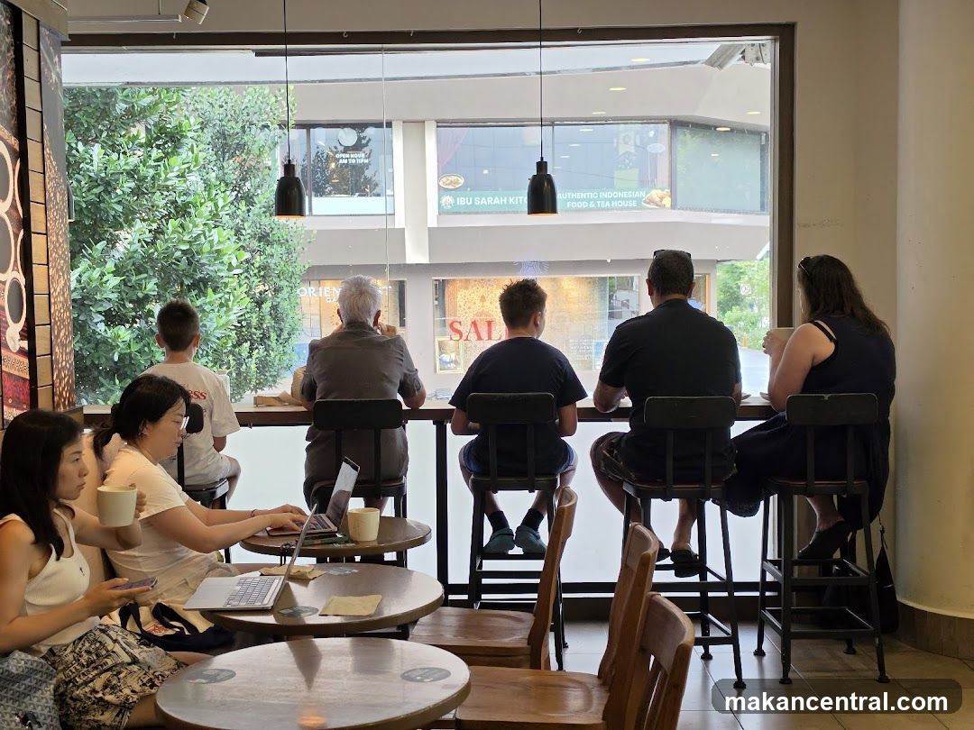 People sitting at a cafe by the window