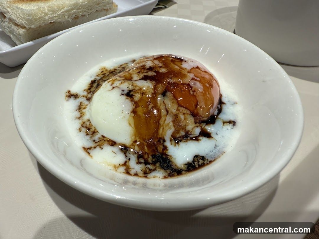 Soft-boiled eggs with soy sauce and toast