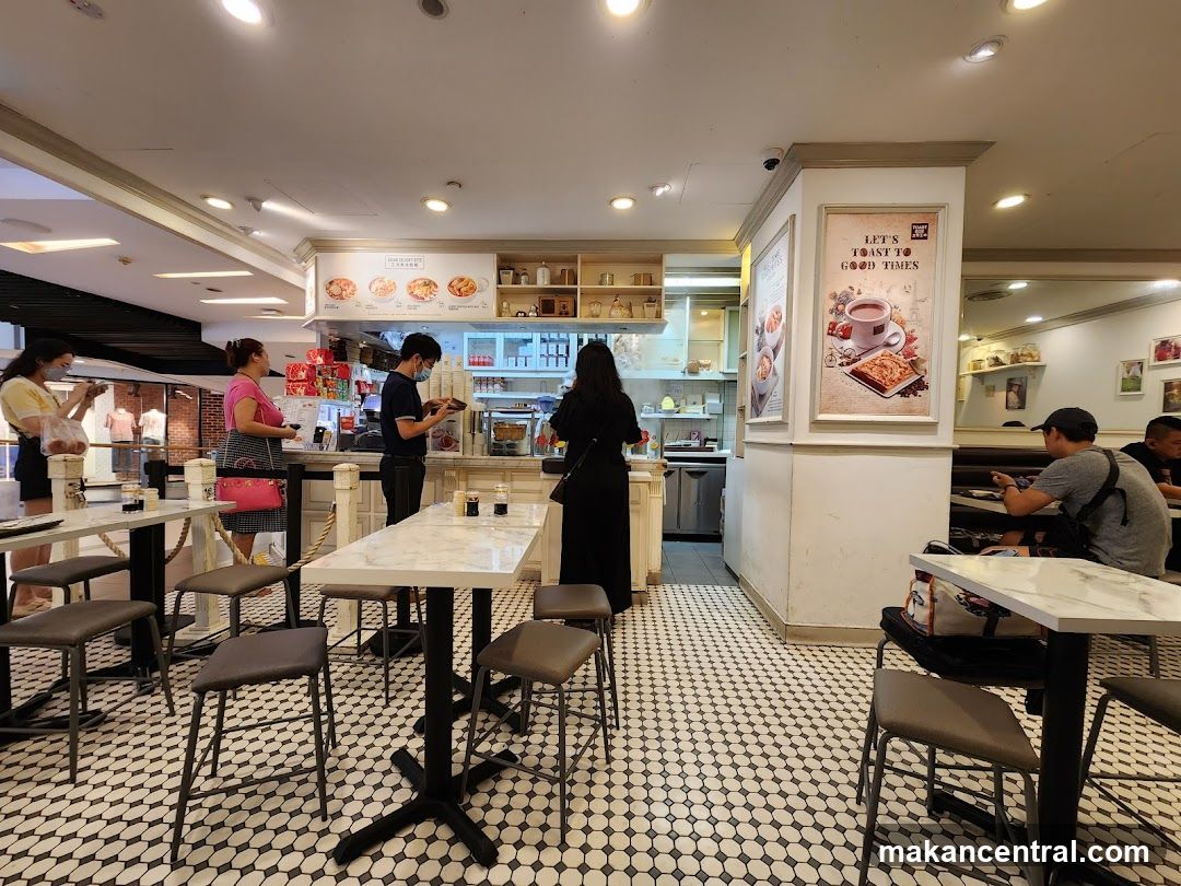 Interior of a cafe with customers and staff