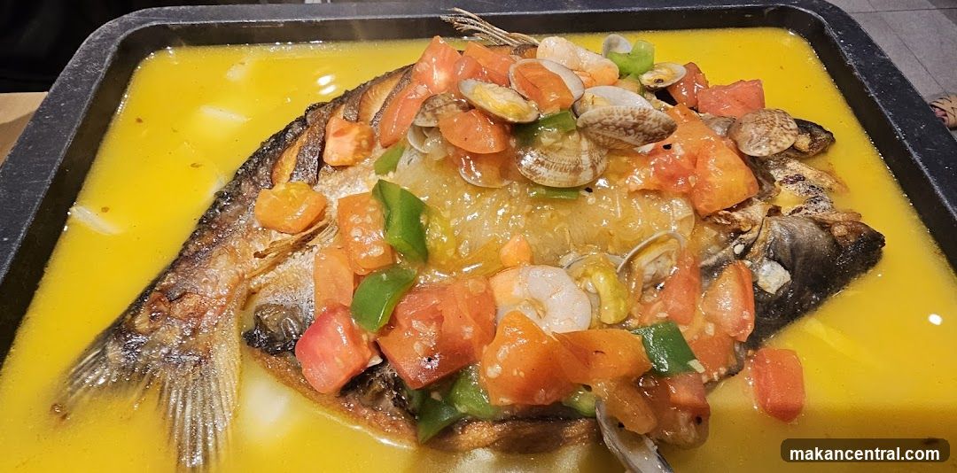 Fish dish with vegetables and seafood