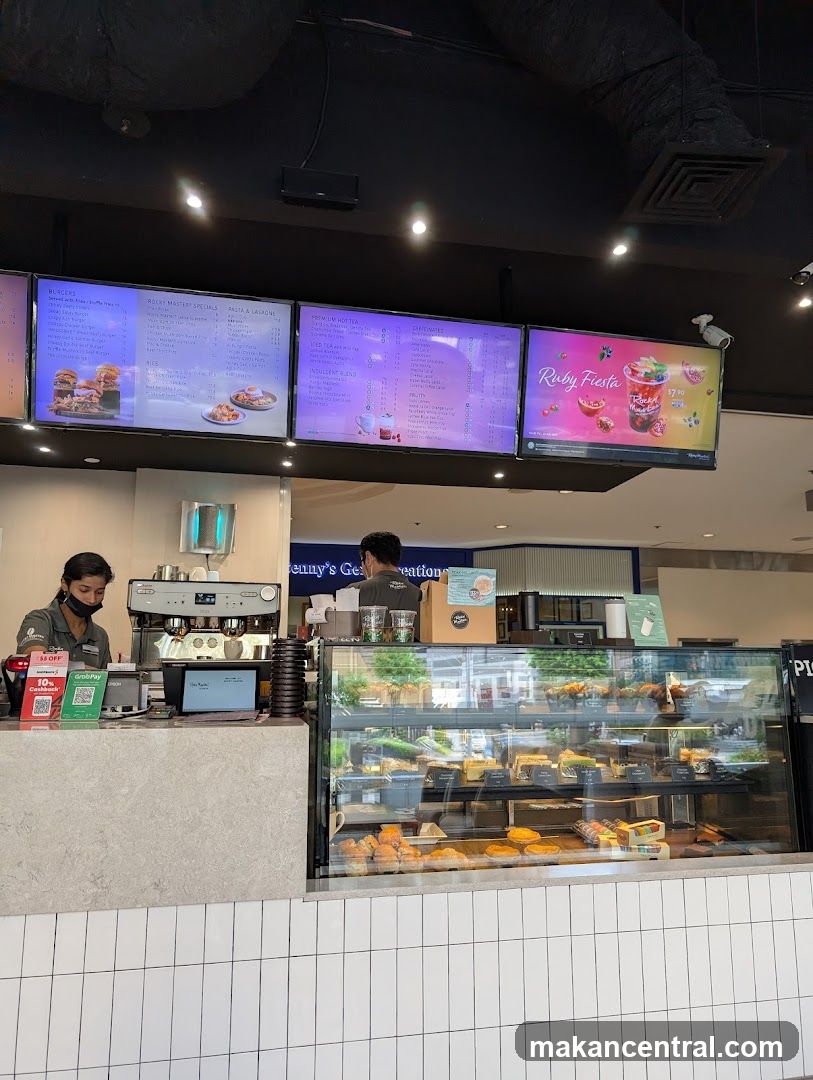 Cafe Counter with Digital Menus and Pastries