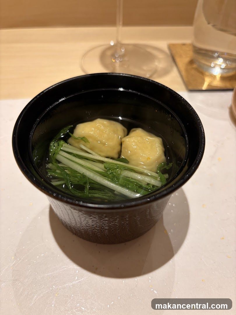 Soup with dumplings and greens