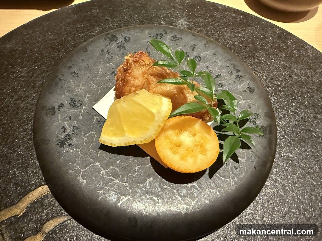 Fried Food with Lemon and Tomato