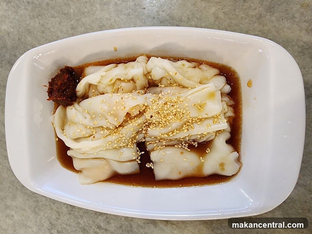 Steamed Rice Rolls with Sauce and Sesame Seeds